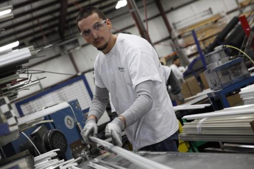 Employee cutting window screen