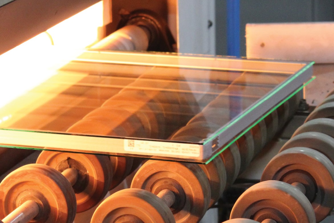 An insulating glass unit enters the oven 