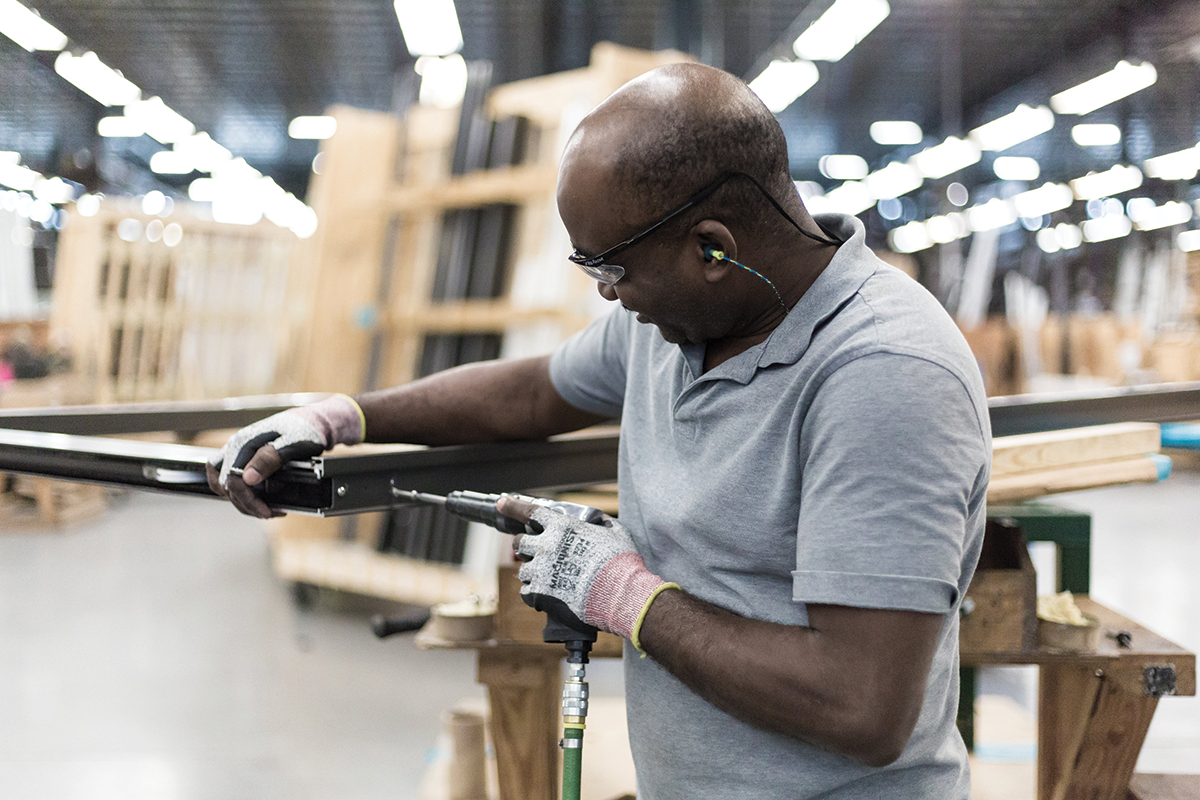 employee works on aluminum product