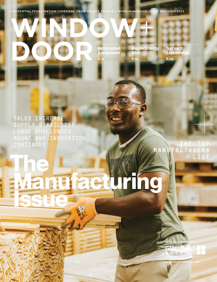 a worker moves pieces of lumber at Marvin Windows and Doors plant on the cover the the May/June issue of Window and Door