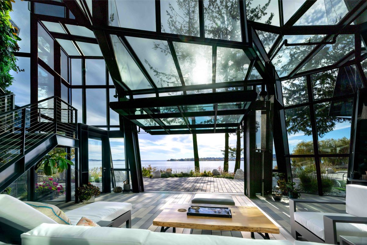 interior of F-House, view to water through glass facade