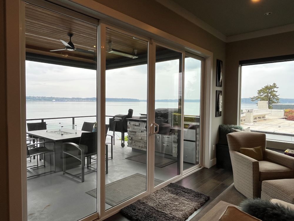 view of water through sliding glass doors