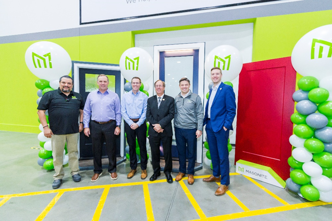 Masonite employees and town officials at ribbon cutting