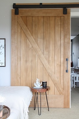 sliding barn doors on barn track hardware can support flexible, transitional living spaces.