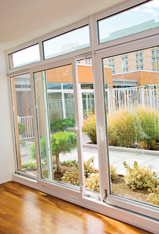 Tilt and slide door with concealed hardware