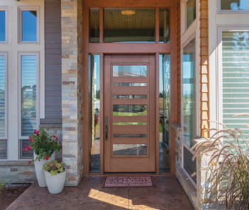 residential entrance with door and transom