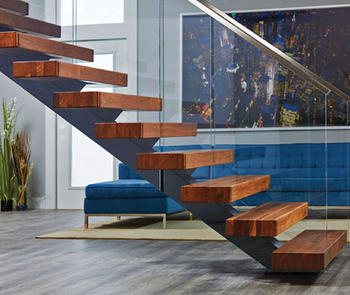 living room stairway with glass railing